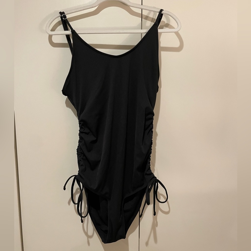 Summer Mae black maternity ribbed one piece swimsuit with side tie detail.